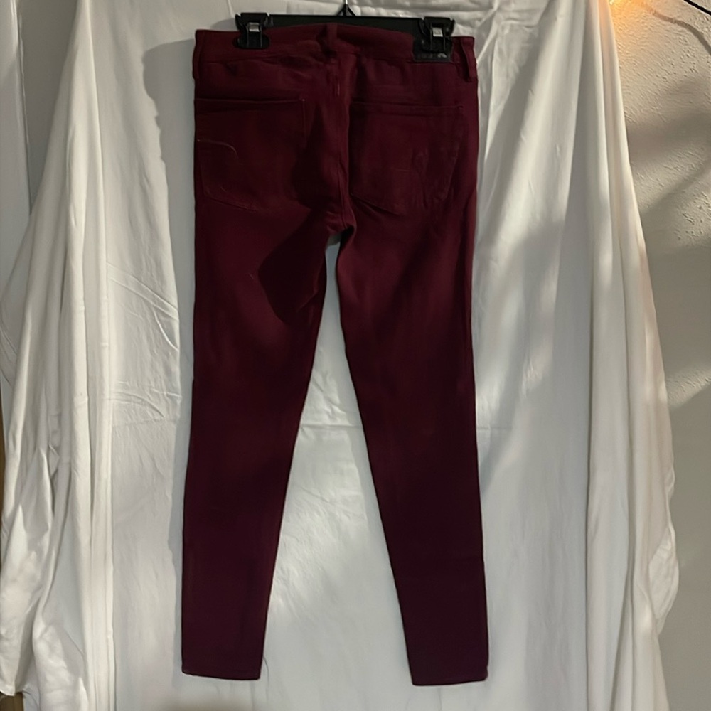 Burgundy/wine color, American Eagle 360 super stretch jegging.